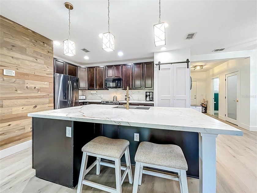 Discover over 3,200 sq.ft. of private living in the highly - photo 7