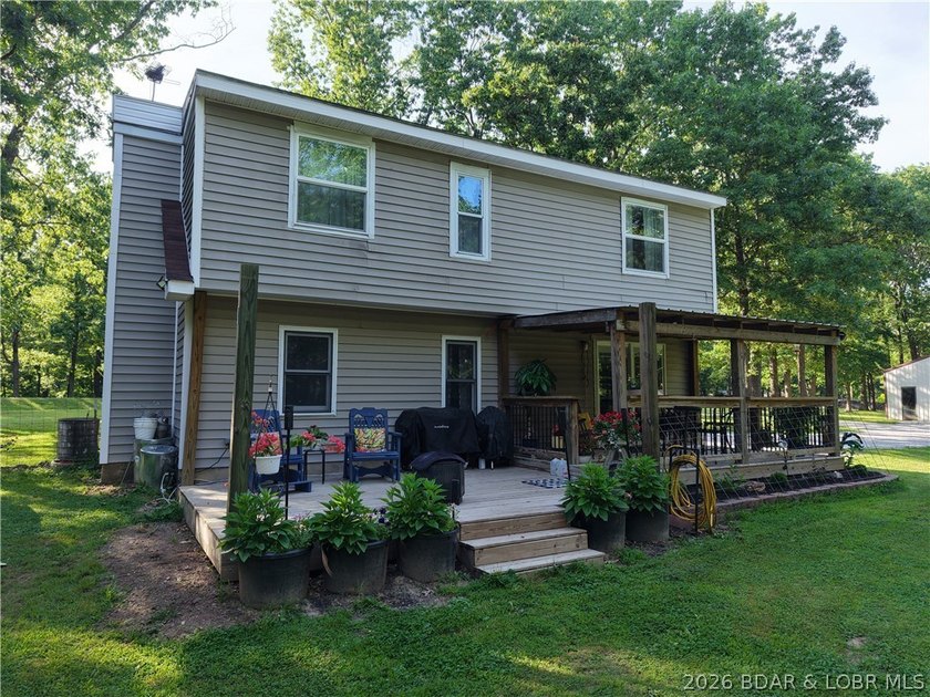 Enjoy peaceful country living on this beautiful 6+ acre property - photo 9