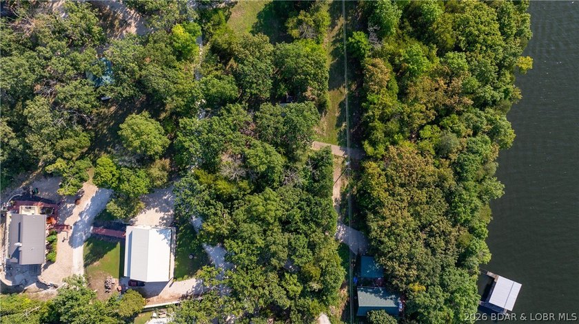 One of a kind property! Boasting 115 feet of Lakefront on the - photo 9