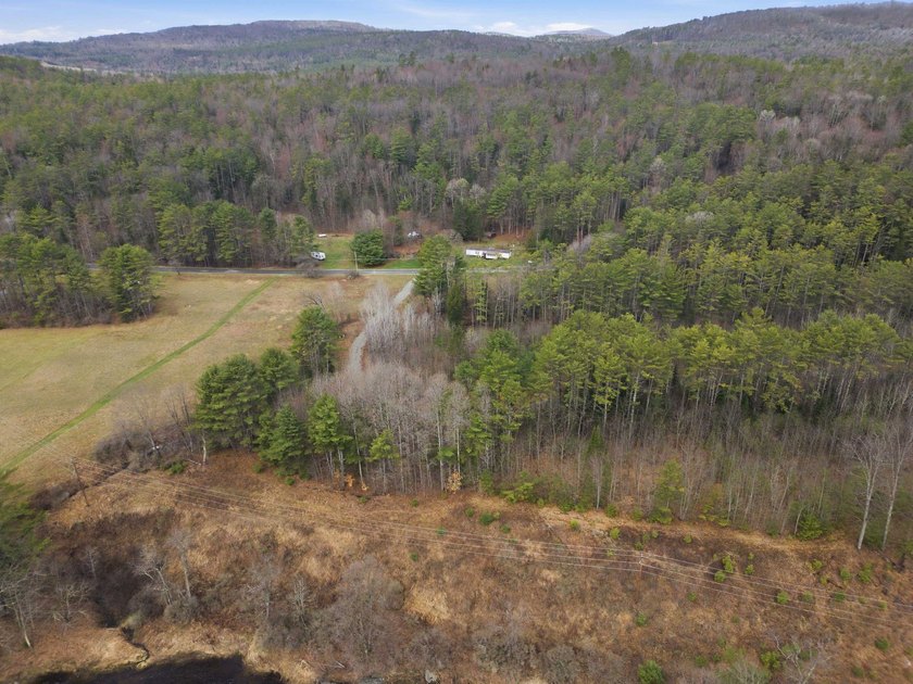 2.55 serene acres with 160 feet of Ammonoosuc River frontage, an - photo 7