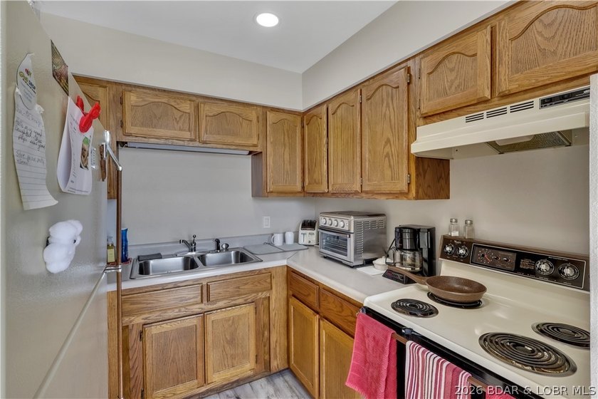 This 3-bedroom, 2-bath home on Nonsuch in Lake Ozark is now - photo 16