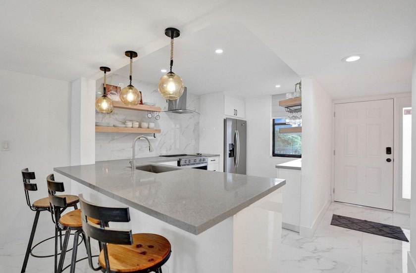 Completely renovated and move-in ready! This stunning unit has - photo 16