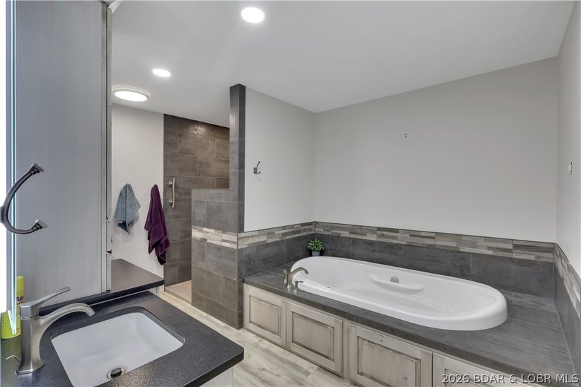 This 3-bedroom, 2-bath home on Nonsuch in Lake Ozark is now - photo 19
