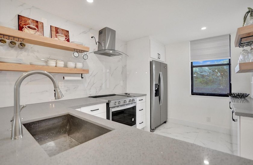 Completely renovated and move-in ready! This stunning unit has - photo 23