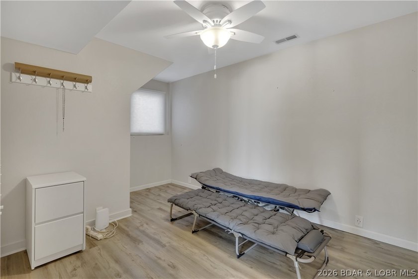 This 3-bedroom, 2-bath home on Nonsuch in Lake Ozark is now - photo 32