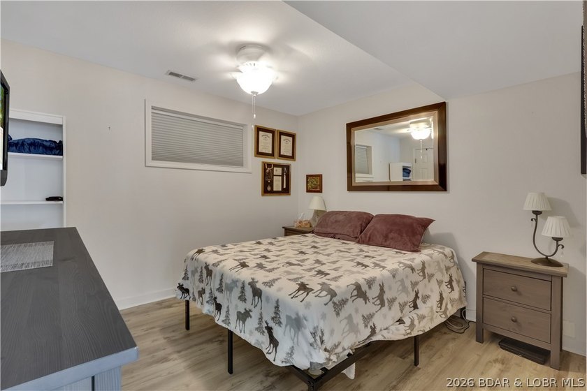 This 3-bedroom, 2-bath home on Nonsuch in Lake Ozark is now - photo 35