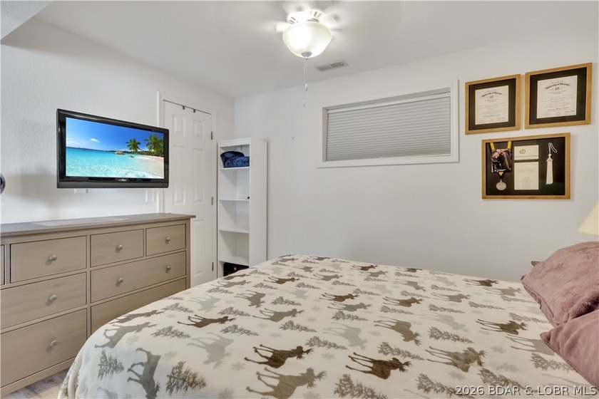 This 3-bedroom, 2-bath home on Nonsuch in Lake Ozark is now - photo 38