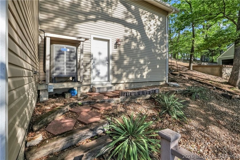This 3-bedroom, 2-bath home on Nonsuch in Lake Ozark is now - photo 49