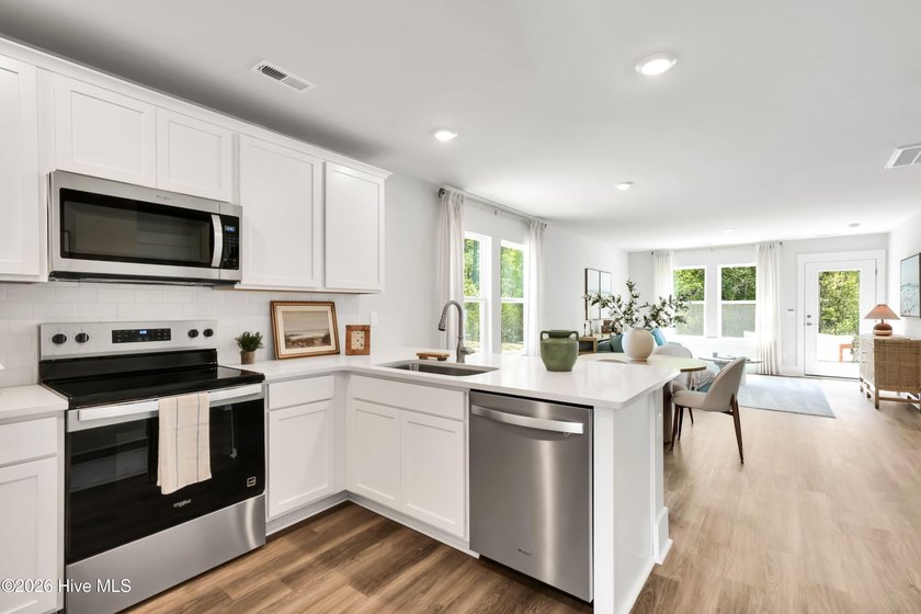 The Norman townhome is a two-story residence with 4 bedrooms and - photo 6