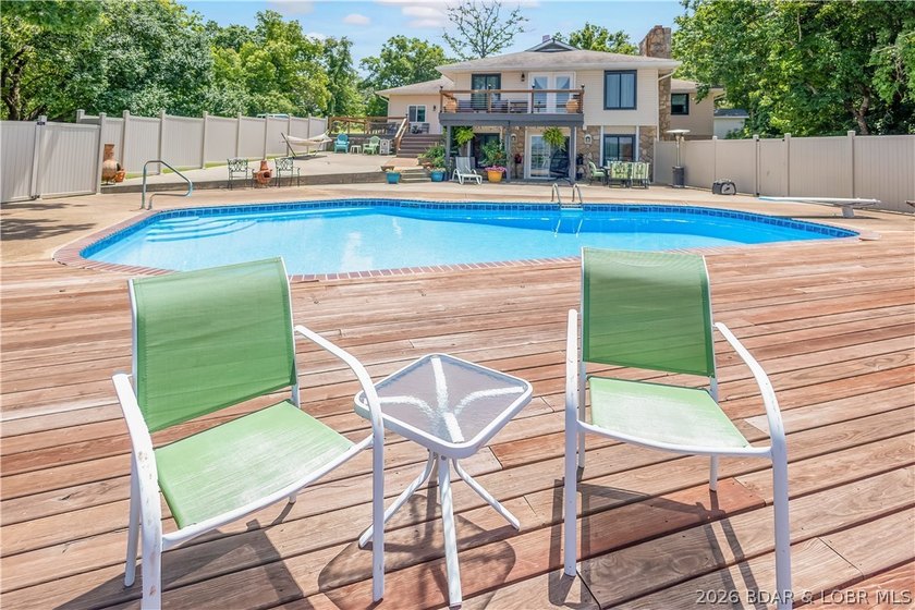 Nestled on over 2 acres with panoramic views of Lake of the - photo 11