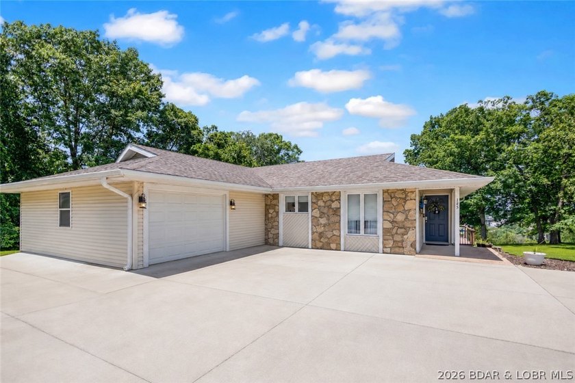 Nestled on over 2 acres with panoramic views of Lake of the - photo 20