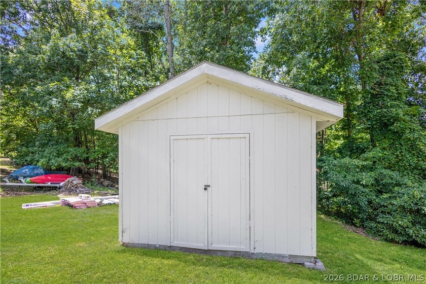 Nestled on over 2 acres with panoramic views of Lake of the - photo 23