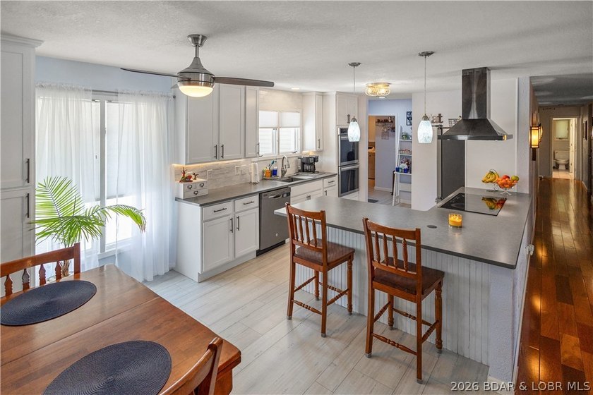 Nestled on over 2 acres with panoramic views of Lake of the - photo 24
