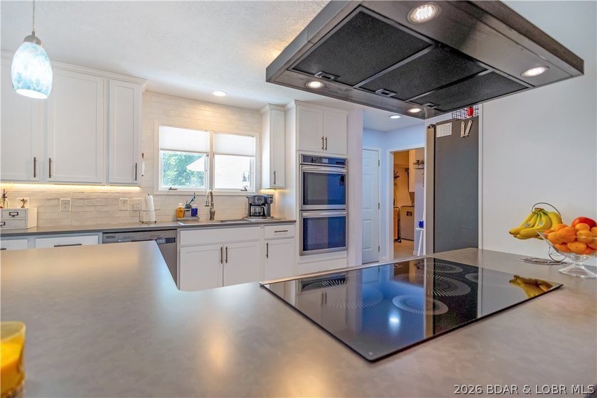 Nestled on over 2 acres with panoramic views of Lake of the - photo 26