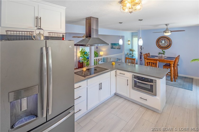 Nestled on over 2 acres with panoramic views of Lake of the - photo 29