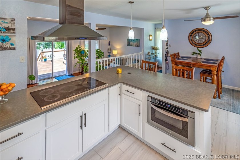 Nestled on over 2 acres with panoramic views of Lake of the - photo 30