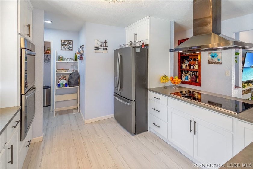 Nestled on over 2 acres with panoramic views of Lake of the - photo 31