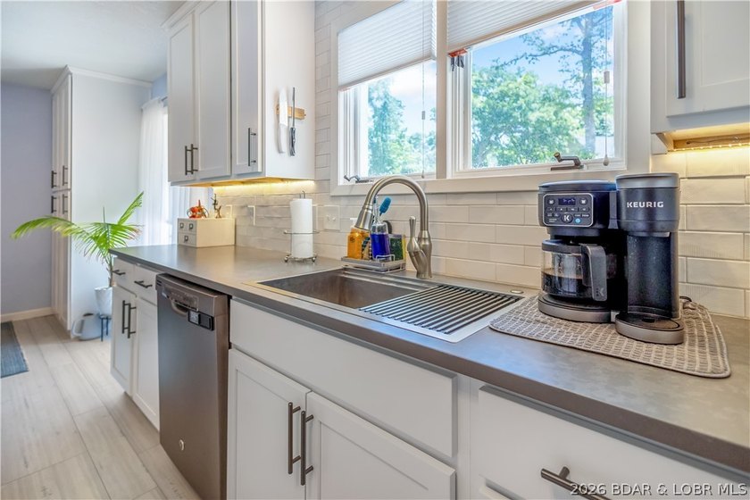 Nestled on over 2 acres with panoramic views of Lake of the - photo 33
