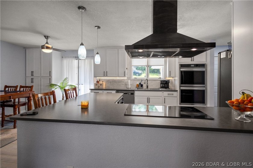 Nestled on over 2 acres with panoramic views of Lake of the - photo 34