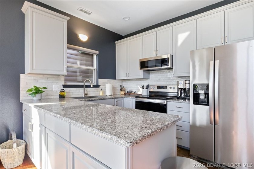Enjoy this beautifully updated cottage at one of the best golf - photo 6