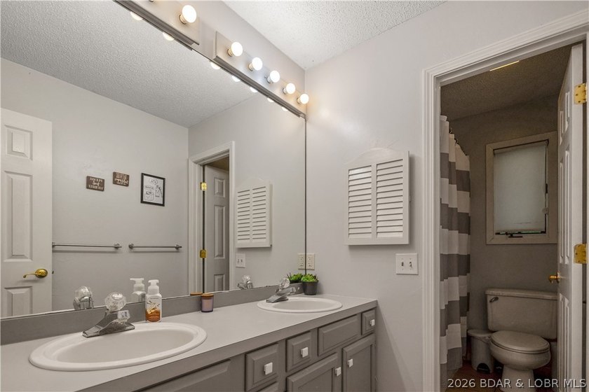 Nestled on over 2 acres with panoramic views of Lake of the - photo 47