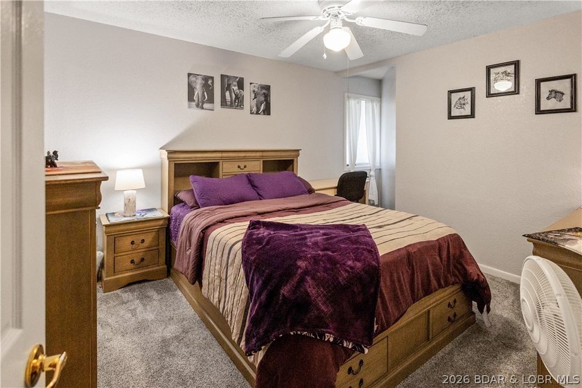 Nestled on over 2 acres with panoramic views of Lake of the - photo 50