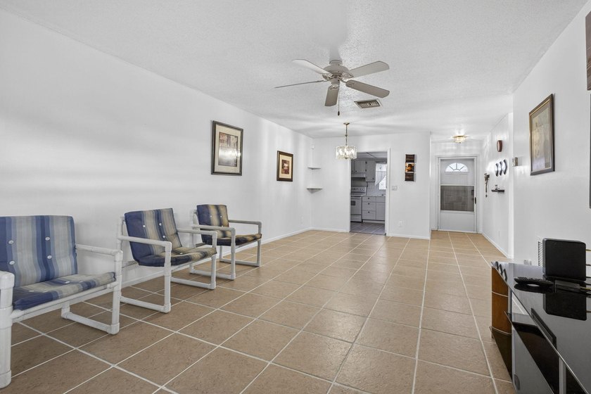 Welcome home to this inviting residence featuring tile floors &amp; - photo 12