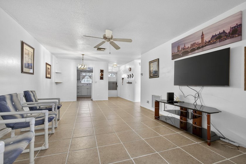 Welcome home to this inviting residence featuring tile floors &amp; - photo 13