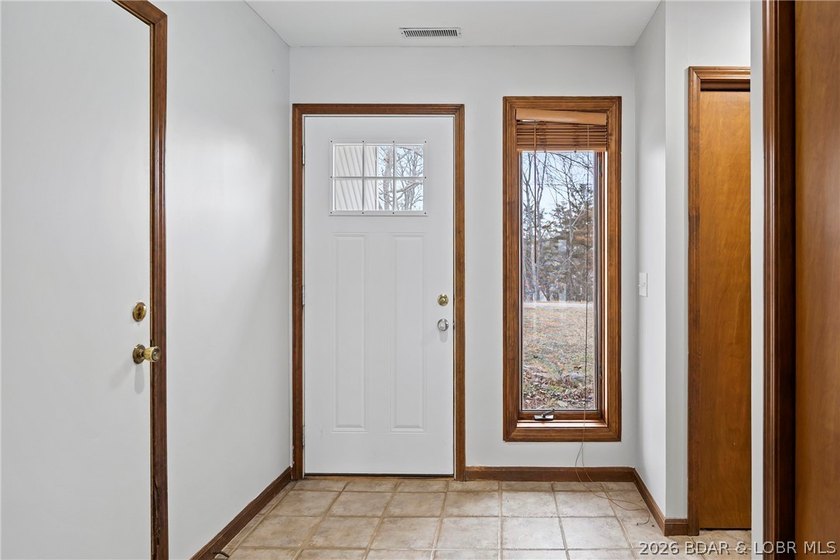 WOW! From the minute you walk in the door, the lake view is - photo 3