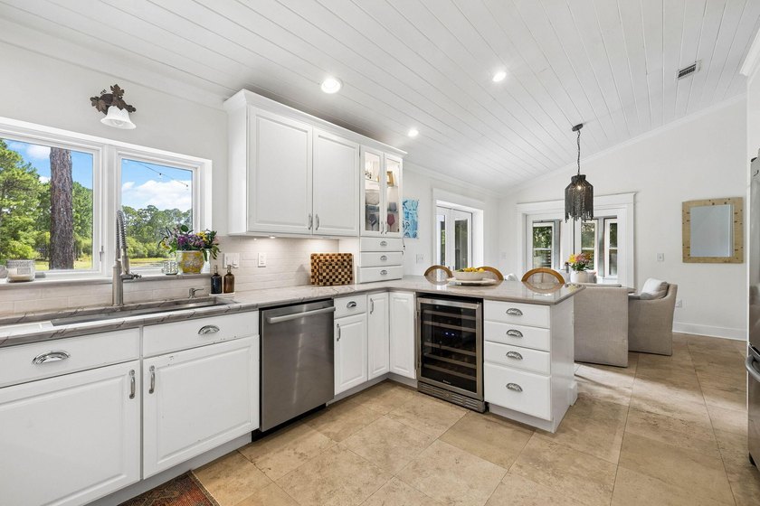Nestled on a private one-acre homesite overlooking the tranquil - photo 14