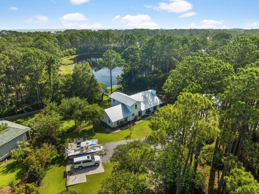 Nestled on a private one-acre homesite overlooking the tranquil - photo 34
