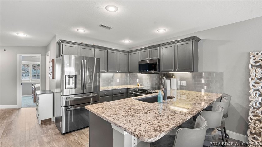 Experience luxury lake living at its finest in this - photo 14