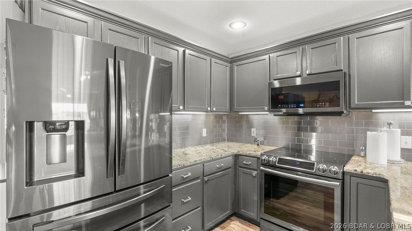 Experience luxury lake living at its finest in this - photo 18
