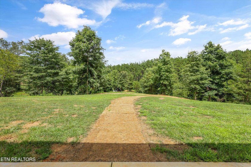 Set on 5.59 acres, this new custom ranch offers a beautiful - photo 44