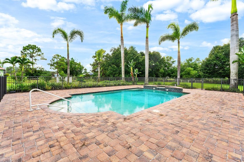 Situated on nearly 2 acres in the gated golf and equestrian - photo 32