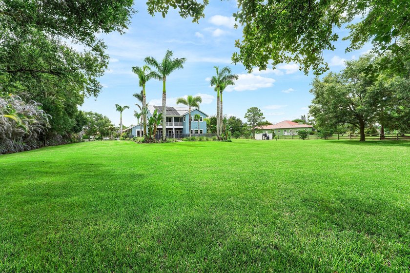 Situated on nearly 2 acres in the gated golf and equestrian - photo 33