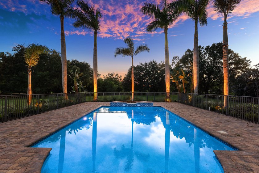 Situated on nearly 2 acres in the gated golf and equestrian - photo 45