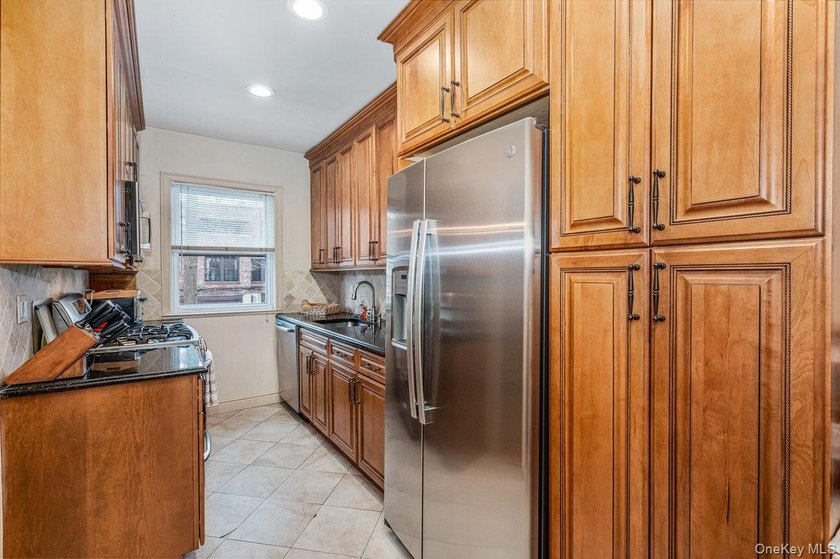 Updated one-family attached brick townhouse nestled in the heart - photo 7