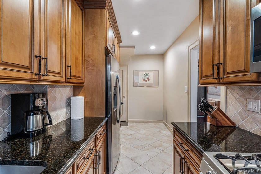 Updated one-family attached brick townhouse nestled in the heart - photo 8