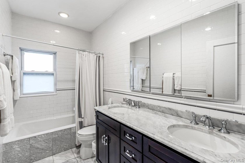 Updated one-family attached brick townhouse nestled in the heart - photo 10