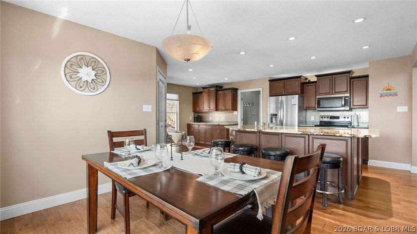 Experience elevated lakefront living in this luxury 4-bedroom, 3 - photo 2