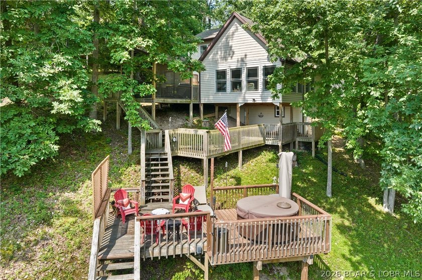 Discover peace and tranquility in this stunning lakefront home - photo 2
