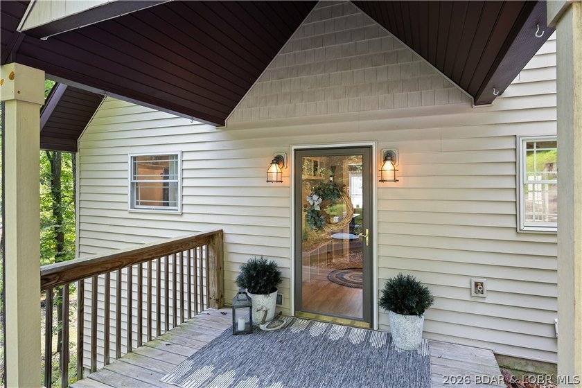 Discover peace and tranquility in this stunning lakefront home - photo 3