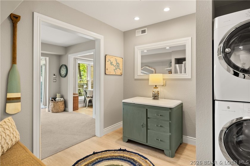 Discover peace and tranquility in this stunning lakefront home - photo 5
