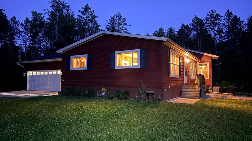 Nestled among the pines just minutes from Lower Post Lake in - photo 27
