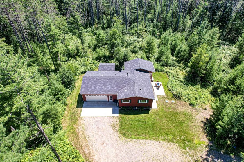 Nestled among the pines just minutes from Lower Post Lake in - photo 33
