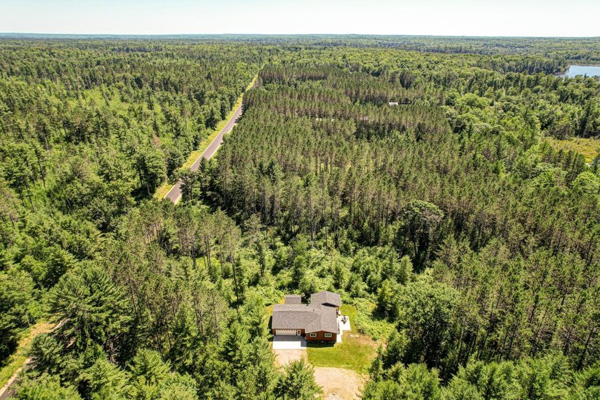 Nestled among the pines just minutes from Lower Post Lake in - photo 34