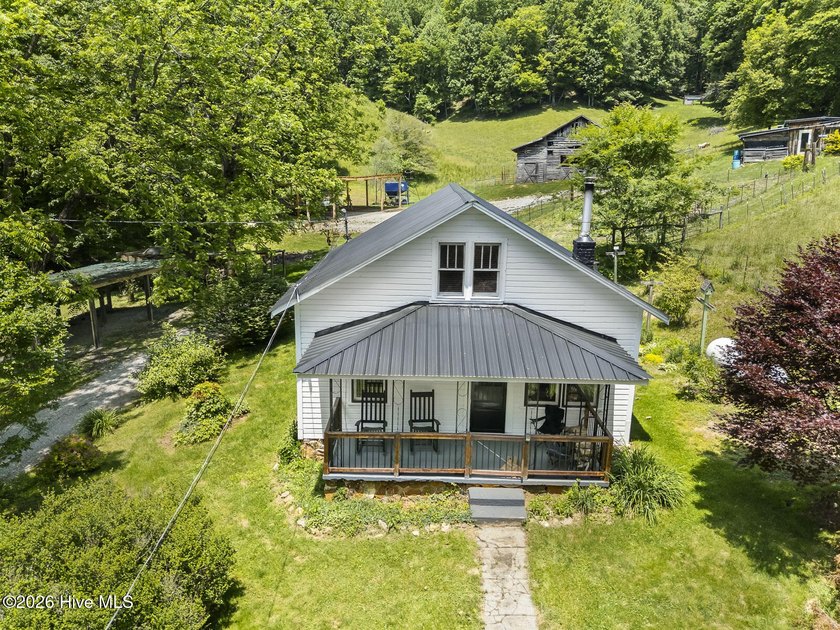 Discover a rare opportunity to own a charming 1940s mountain - photo 6