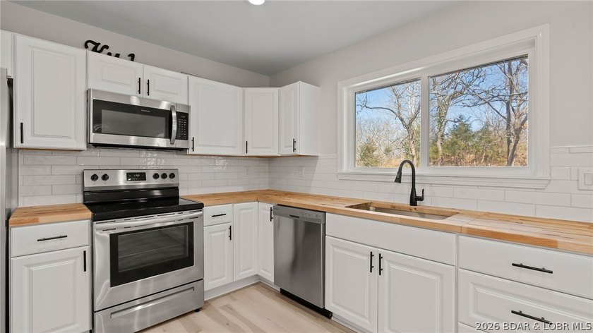 Lake view home with modern updates! This newly remodeled home - photo 9