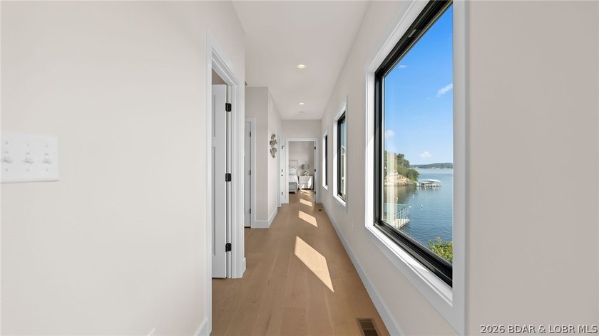 NEW CONSTRUCTION! Unobstructed lake views and luxury living - photo 10